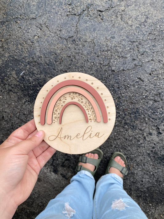Rainbow and wreath sign